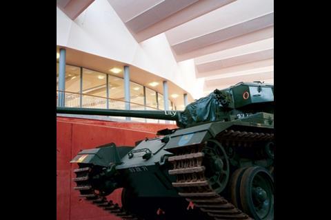 At the Tank Museum in Bovington, Dorset, narrow roof apertures create directional light, partly diffused by inter-reflections from the soffit.